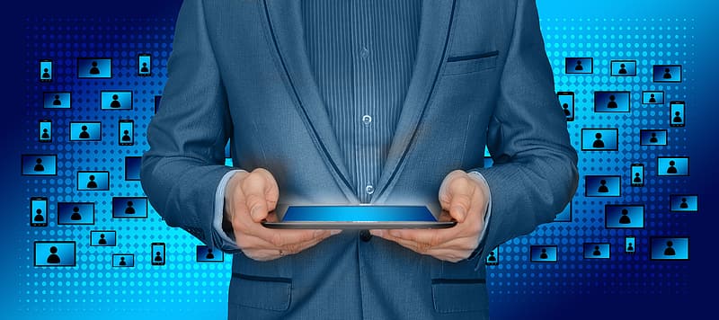 person-wearing-suit-holding-tablet-computer